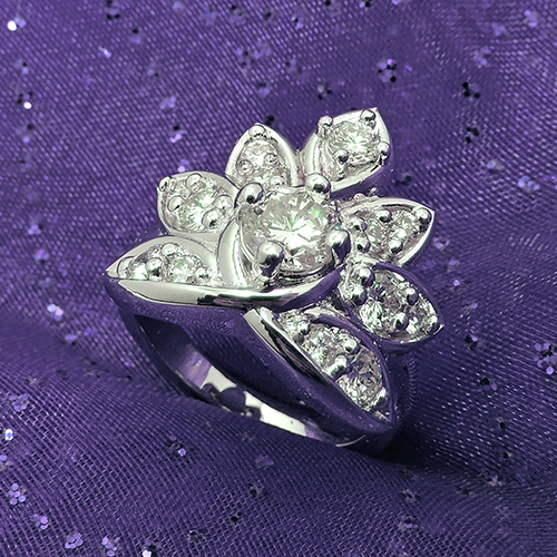 An Elegant Diamond Ring with a Violet Background Made Through Custom Jewelry Design and Jewelry Repair in Colorado Springs