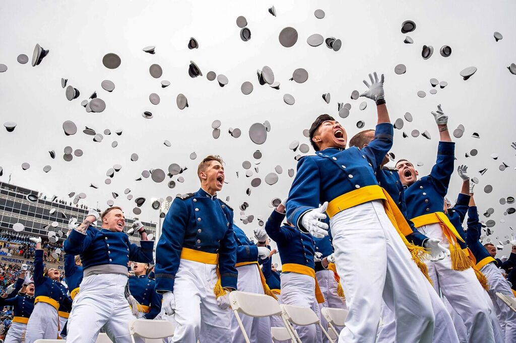 U.S. Air Force Academy Class of 2025 graduates toss their hats at Falcon Stadium in Colorado Springs, Colorado., May 29, 2025.